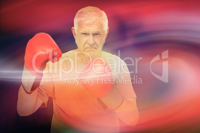 Composite image of portrait of a determined senior boxer