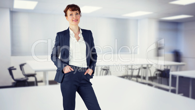 Composite image of smiling businesswoman