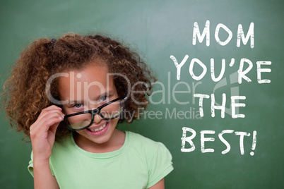 Composite image of cute pupil tilting glasses