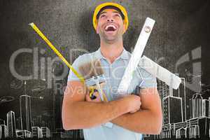 Composite image of laughing manual worker holding various tools