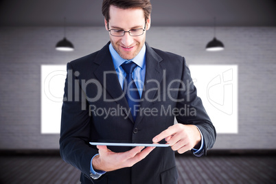 Composite image of businessman standing while using a tablet pc Composite image of businessman standing while using a tablet pc