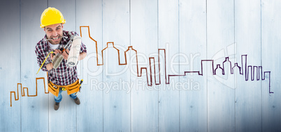 Composite image of frustrated handyman holding various tools