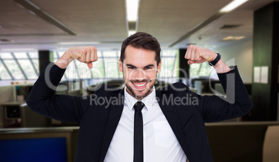 Composite image of happy businessman in suit cheering