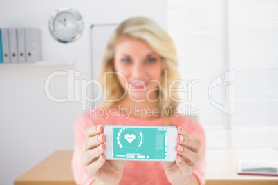 Composite image of pretty blonde showing her smartphone