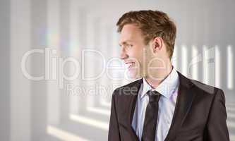 Composite image of young handsome businessman looking away