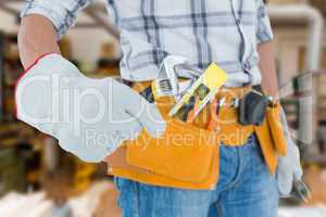 Composite image of technician using adjustable wrench against wh