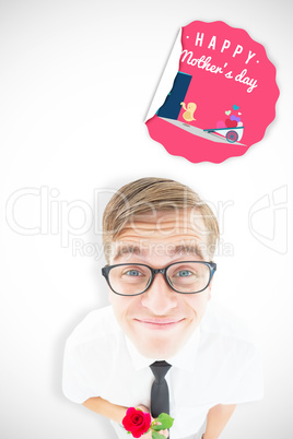 Composite image of geeky hipster holding a red rose