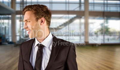 Composite image of young handsome businessman looking away