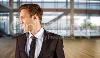 Composite image of young handsome businessman looking away