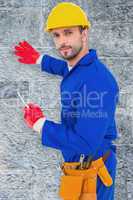 Composite image of handyman holding spanner