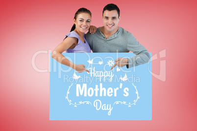 Composite image of young couple pointing at advertisement below