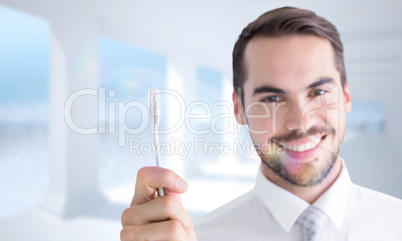 Composite image of happy businessman holding white cable