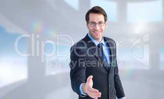 Composite image of hand being offered by smiling businessman