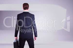 Composite image of rear view businessman standing with his brief