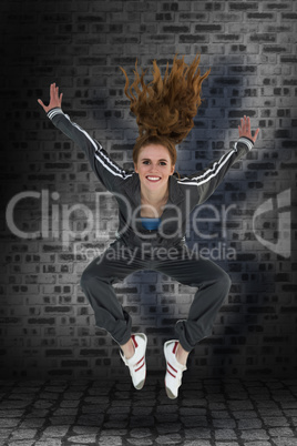 Composite image of full length of a sporty young blond jumping