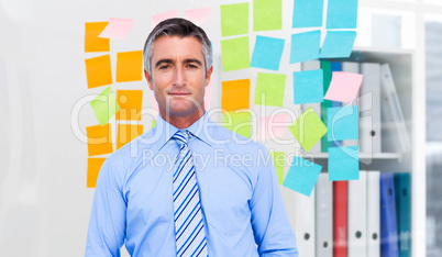 Composite image of smiling businessman in suit with hands in poc