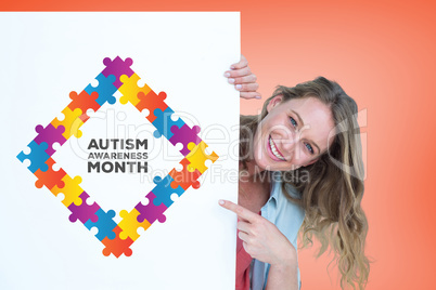 Composite image of woman holding poster