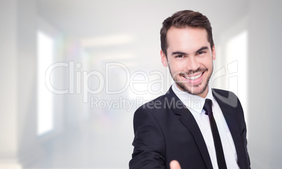 Composite image of portrait of smiling businessman offering hand
