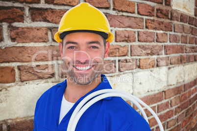 Composite image of electrician carrying wires over white backgro