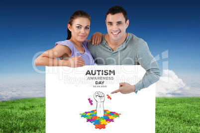 Composite image of young couple presenting advertisement