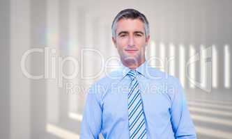 Composite image of smiling businessman in suit with hands in poc