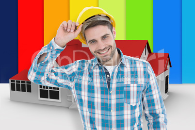 Composite image of confident male technicial wearing hard hat