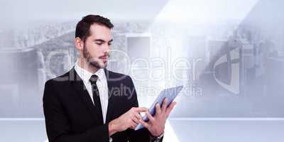 Composite image of cheerful businessman touching digital tablet