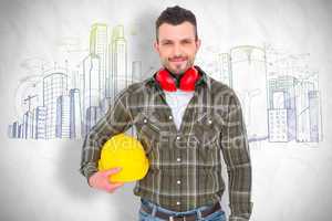 Composite image of handyman with earmuffs holding helmet