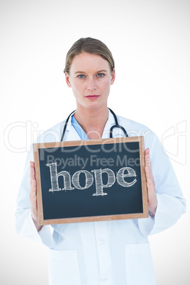 Hope against doctor showing chalkboard Hope against doctor showing chalkboard