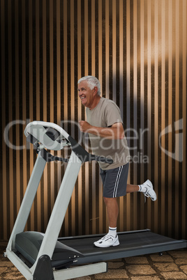 Composite image of full length of a senior man running on a trea