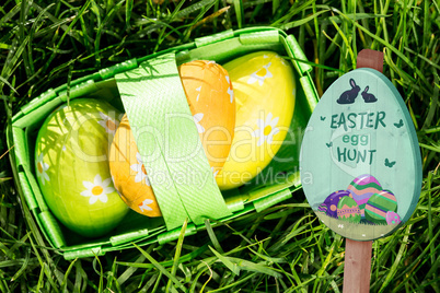 Composite image of easter egg hunt sign