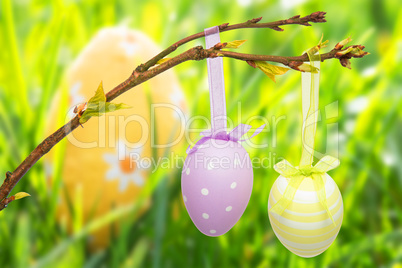 Composite image of hanging easter eggs