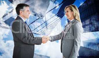 Composite image of pleased businessman shaking the hand of conte