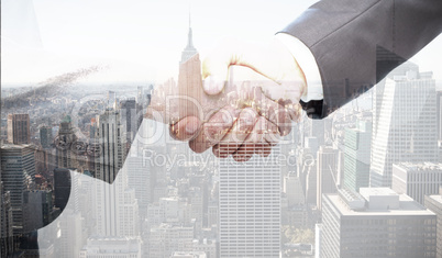 Composite image of handshake between two business people