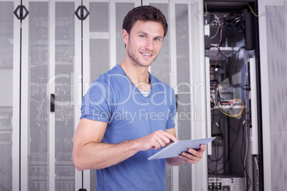 Composite image of man scrolling through tablet pc