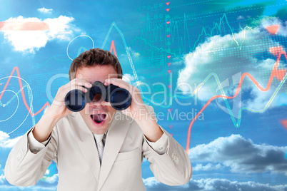 Composite image of positive businessman using binoculars