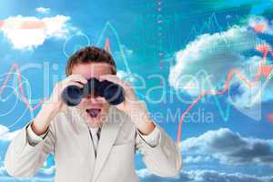 Composite image of positive businessman using binoculars