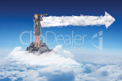 Composite image of businesswoman looking through a telescope