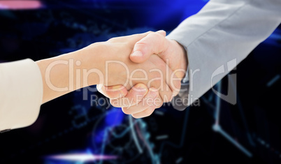 Composite image of closeup of shaking hands after business meeti