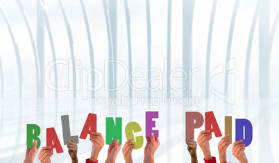 Composite image of hands holding up balance paid