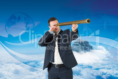 Composite image of businessman looking through telescope