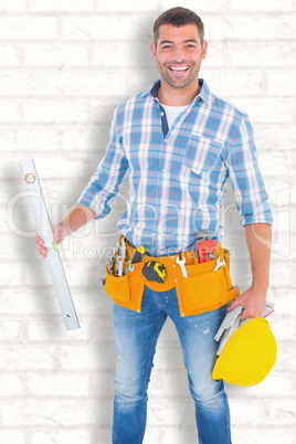 Composite image of portrait of smiling manual worker holding spi