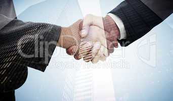 Composite image of handshake between two business people