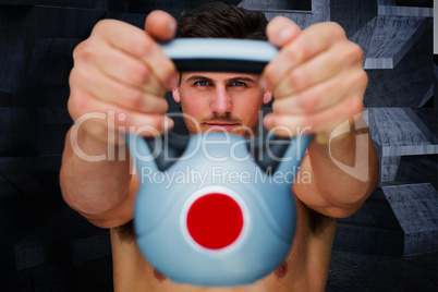 Composite image of bodybuilder holding kettlebell