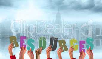 Composite image of hands showing resources