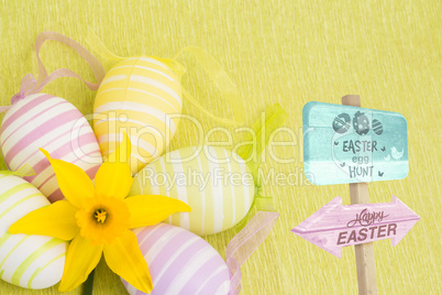 Composite image of easter egg hunt sign