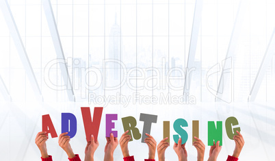 Composite image of hands showing advertising