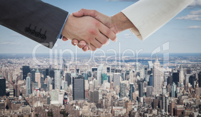 Composite image of shaking hands over eye glasses and diary afte