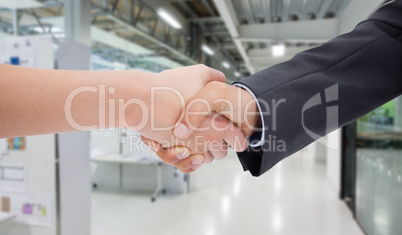 Composite image of close up of a handshake