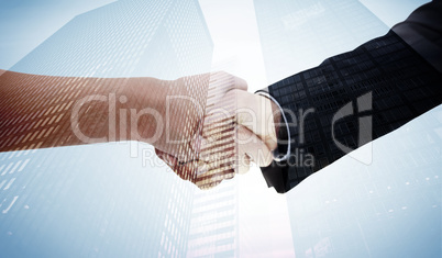 Composite image of close up of a handshake